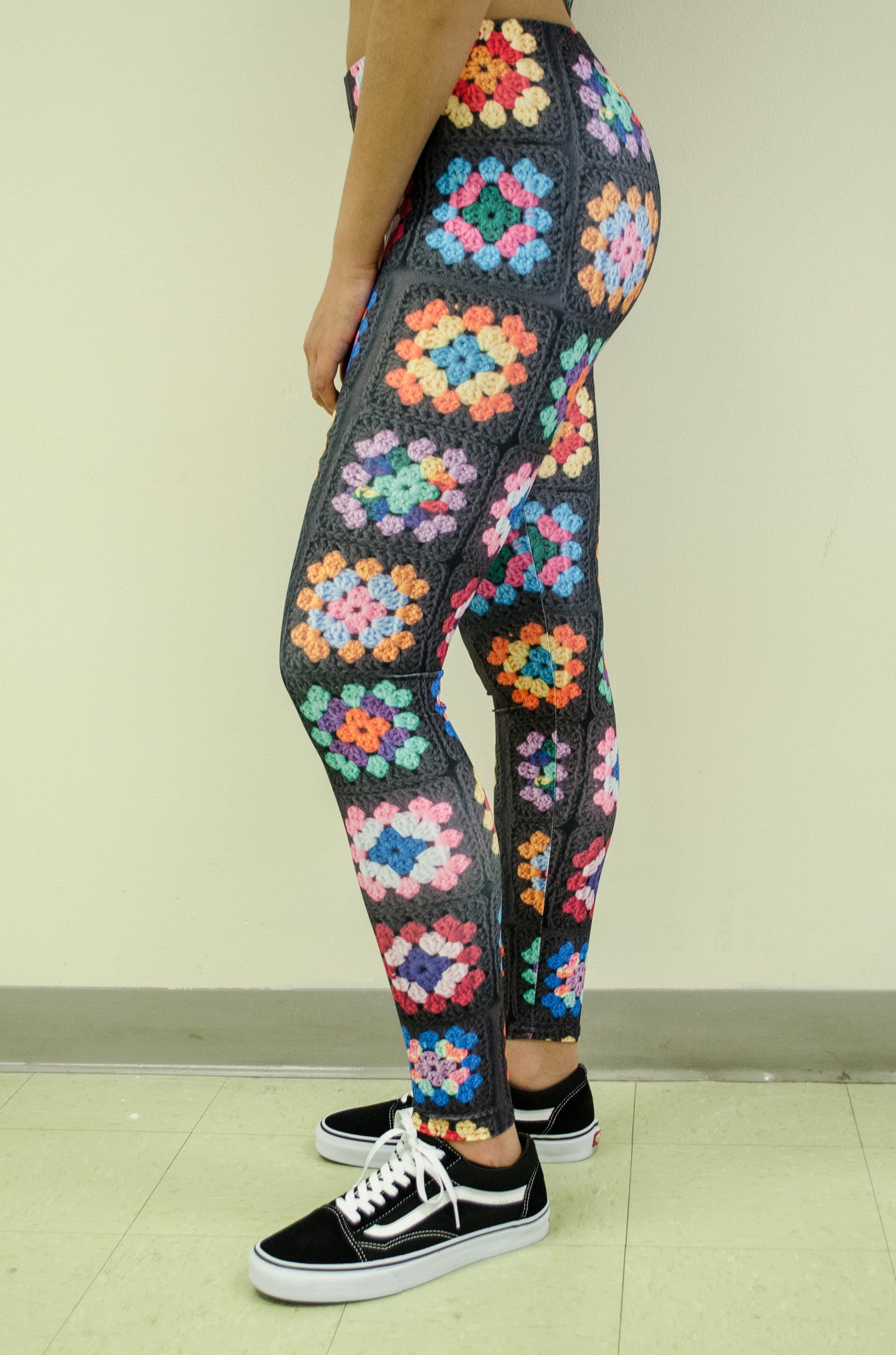 Snapdragon Brand Clothing Granny Square Crochet Print black leggings in style Kaleidoscope features a 1960s vintage boho feel and a rainbow of colors. Made of comfortable spandex.