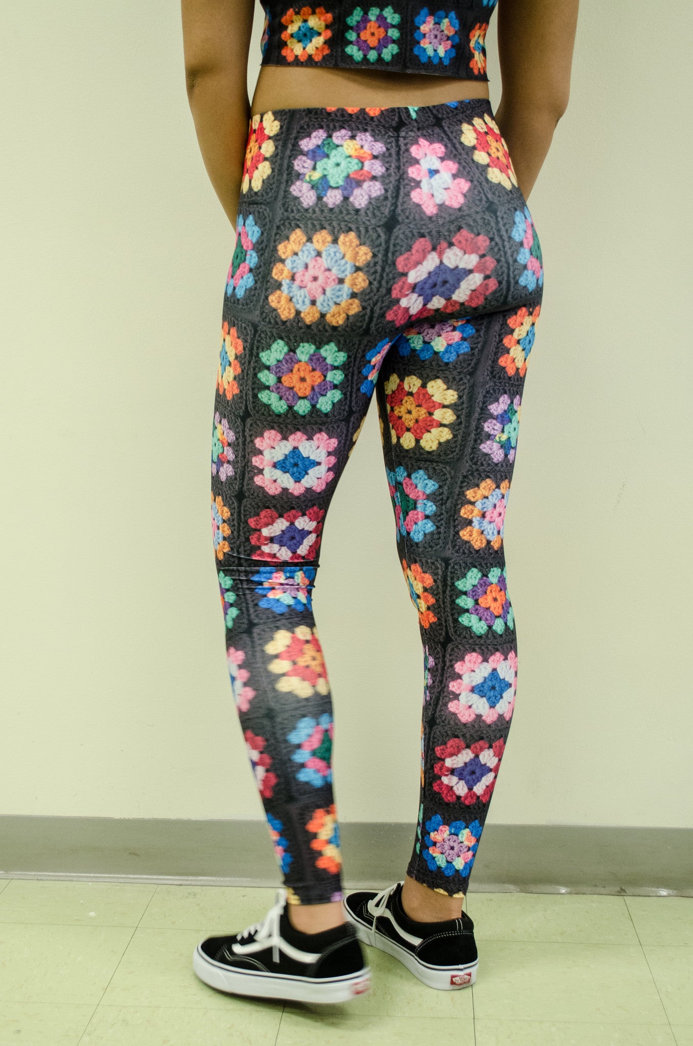 Snapdragon Brand Clothing Granny Square Crochet Print black leggings in style Kaleidoscope features a 1960s vintage boho feel and a rainbow of colors. Made of comfortable spandex.