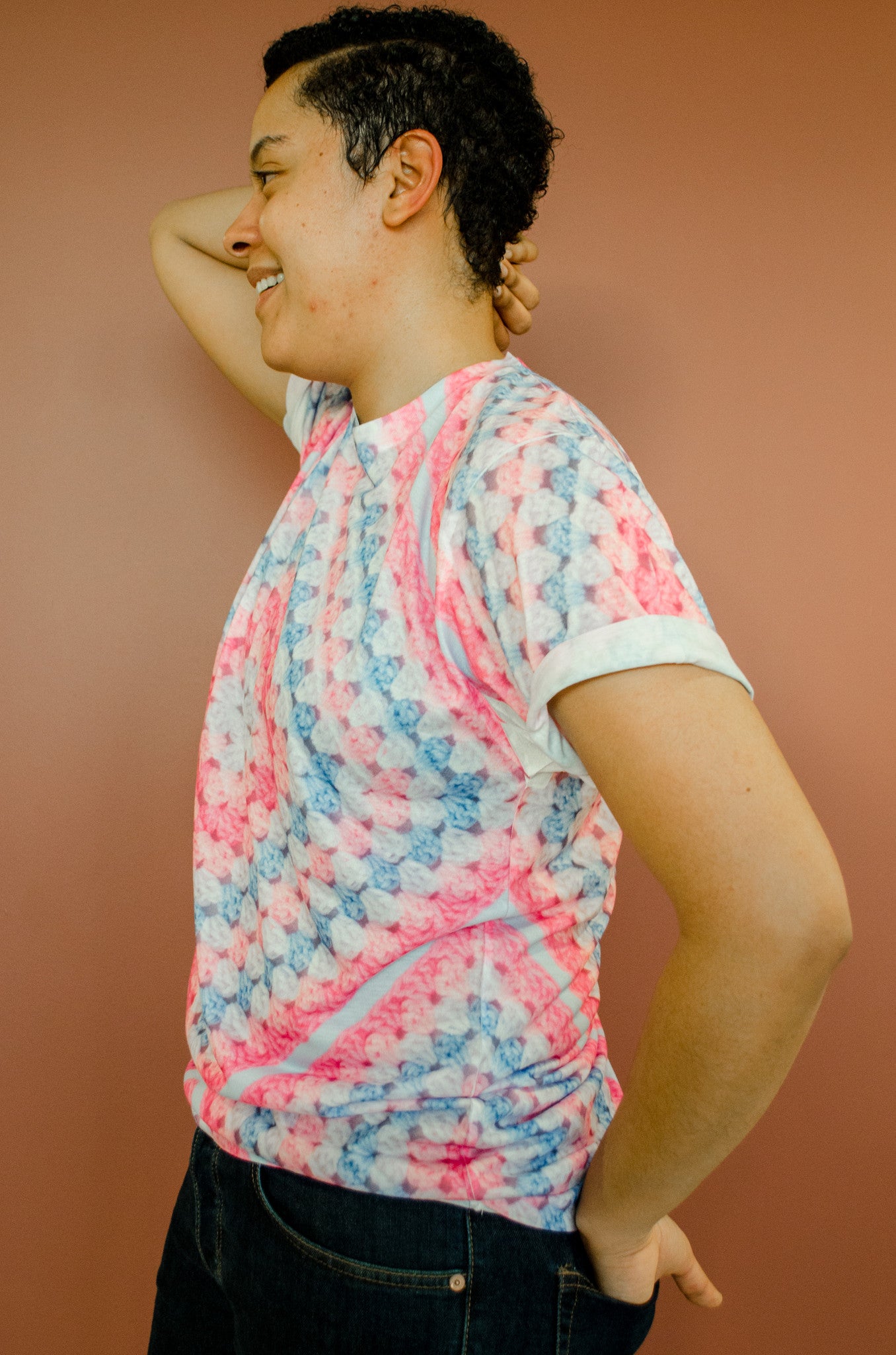 Snapdragon Brand Clothing Granny Square Crochet Print pink and blue t-shirt in style Cotton Candy features a Melanie Martinez boho feel and a pastel rainbow of colors. Made of comfortable polyester.