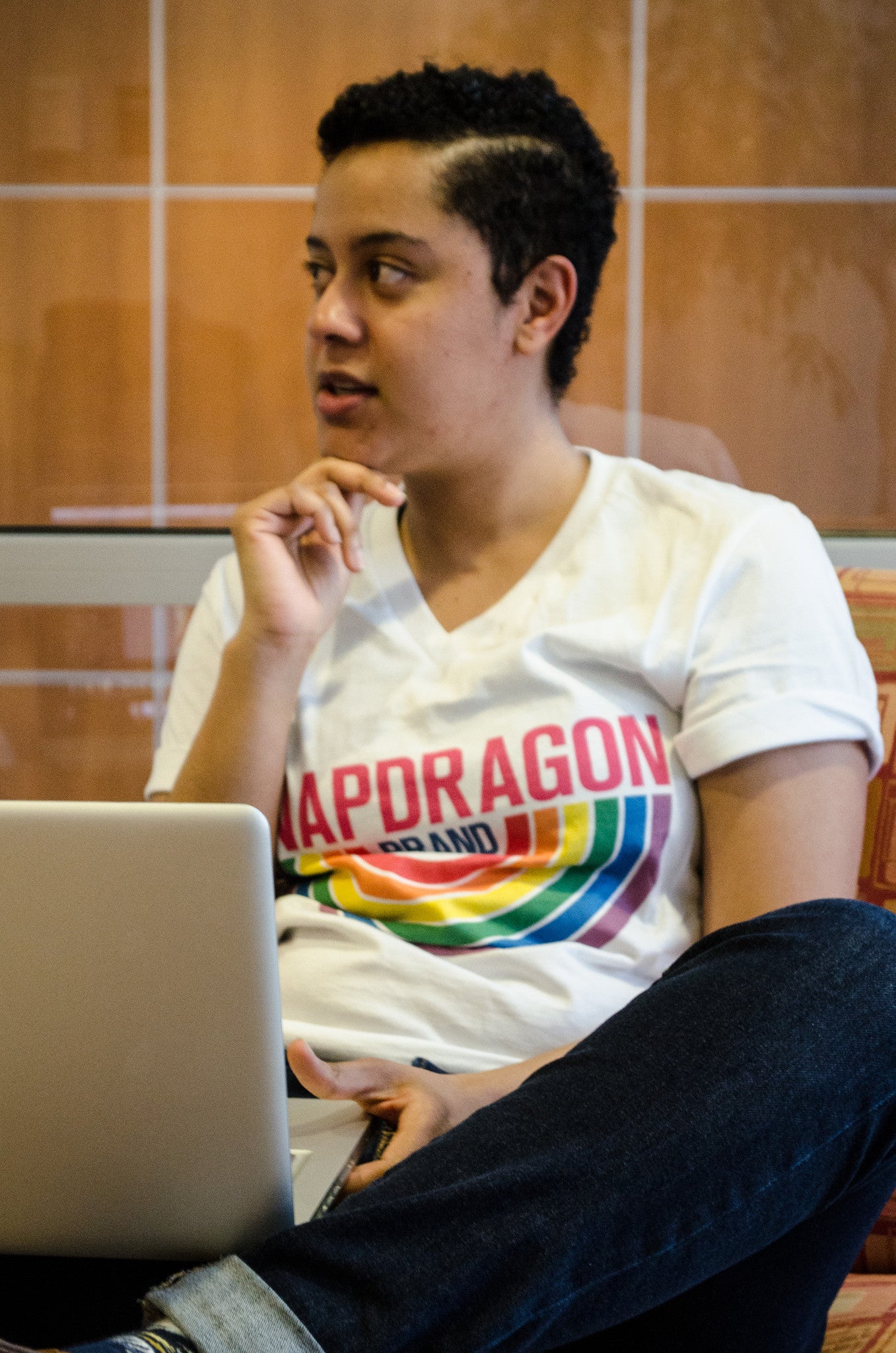 Snapdragon Brand Clothing Granny Square Crochet Print unisex rainbow v-neck tee t-shirt in style logo features a vintage psychedelic boho feel and a rainbow of colors. Made of comfortable cotton. lgbt lgbtq lgbtqi