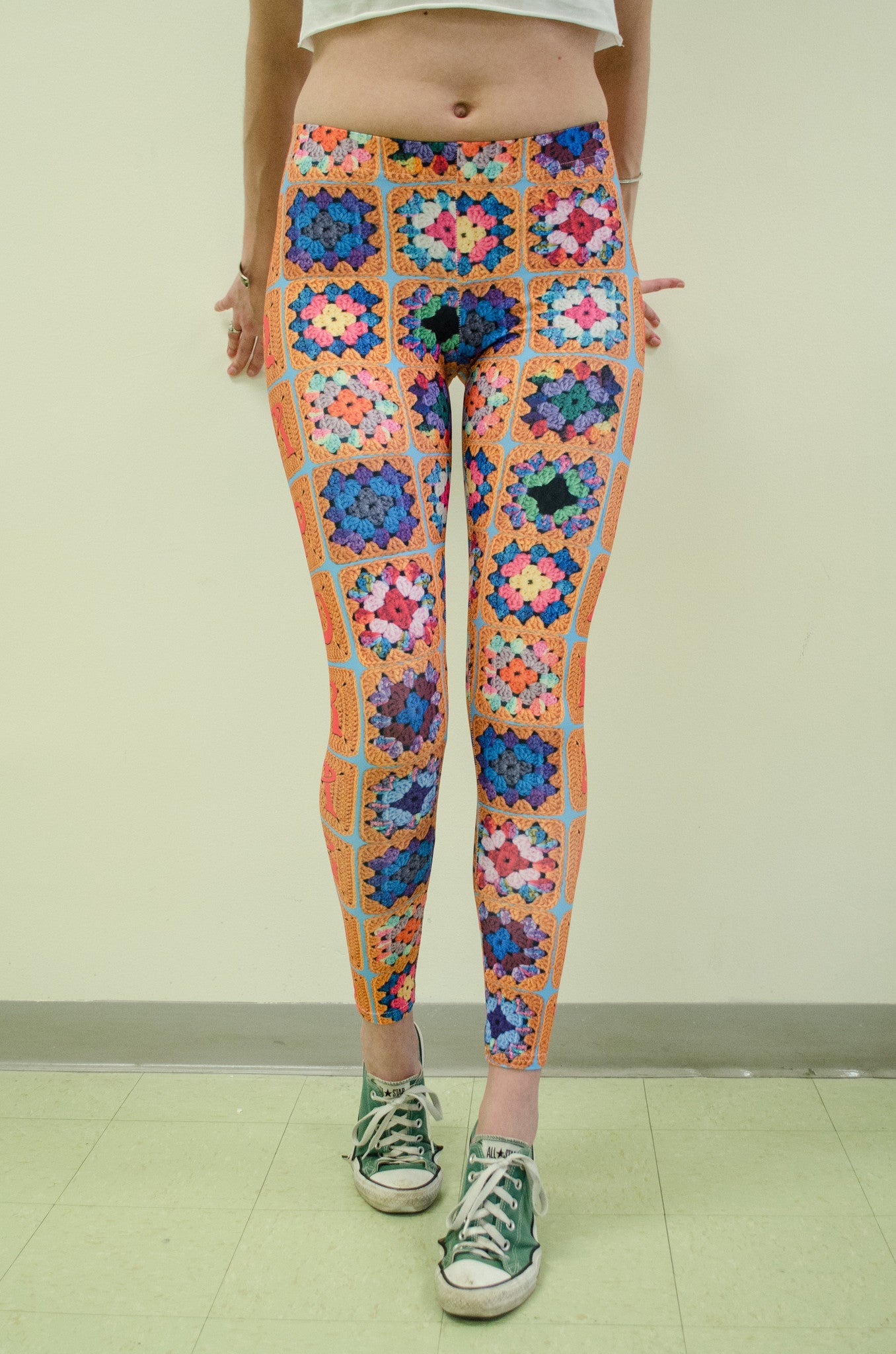 Snapdragon Brand Clothing Granny Square Crochet Print gold leggings in style Snappy features a 1970s vintage feel and a rainbow of colors. Made of comfortable spandex. 