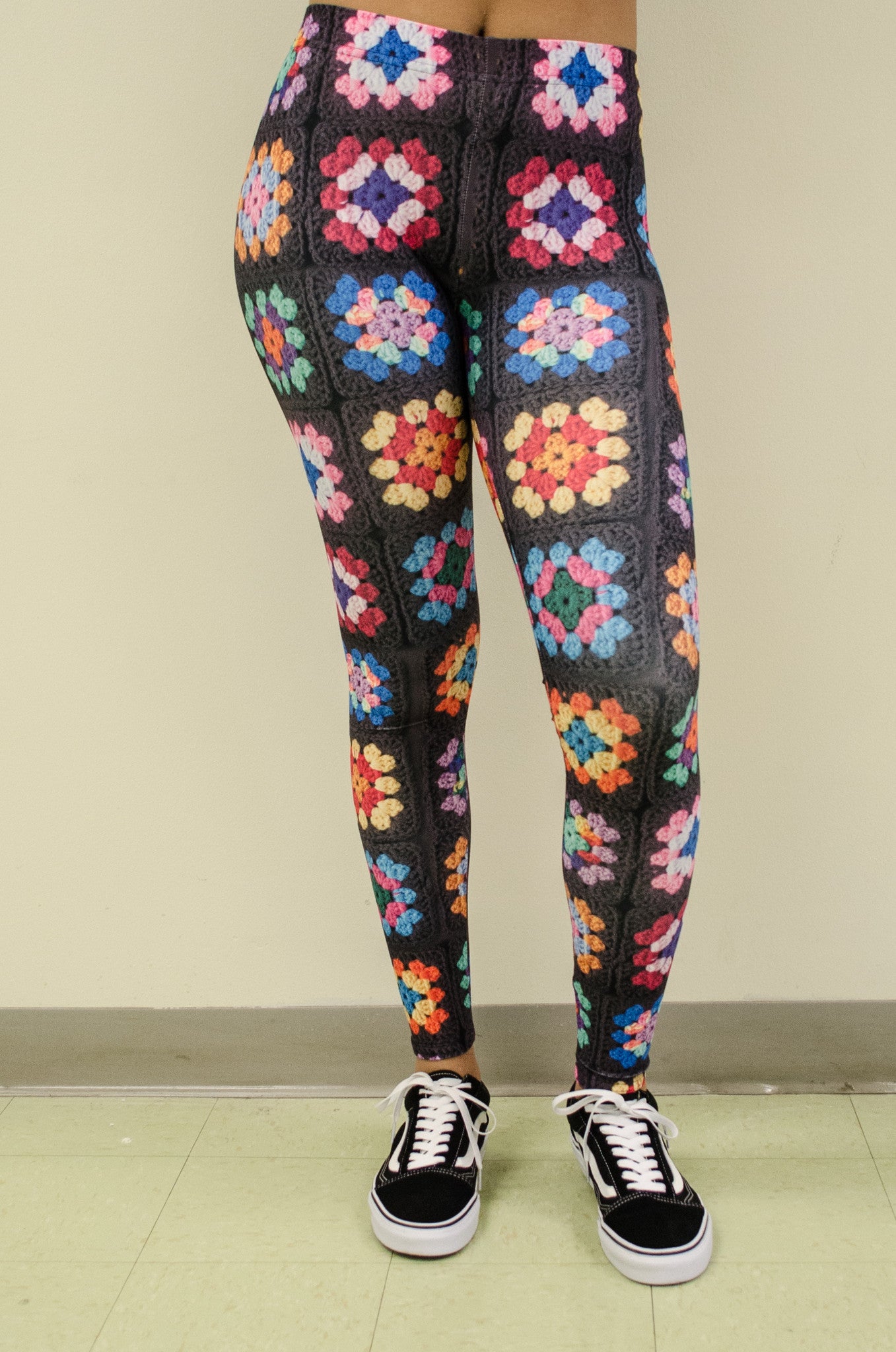Snapdragon Brand Clothing Granny Square Crochet Print black leggings in style Kaleidoscope features a 1960s vintage boho feel and a rainbow of colors. Made of comfortable spandex.
