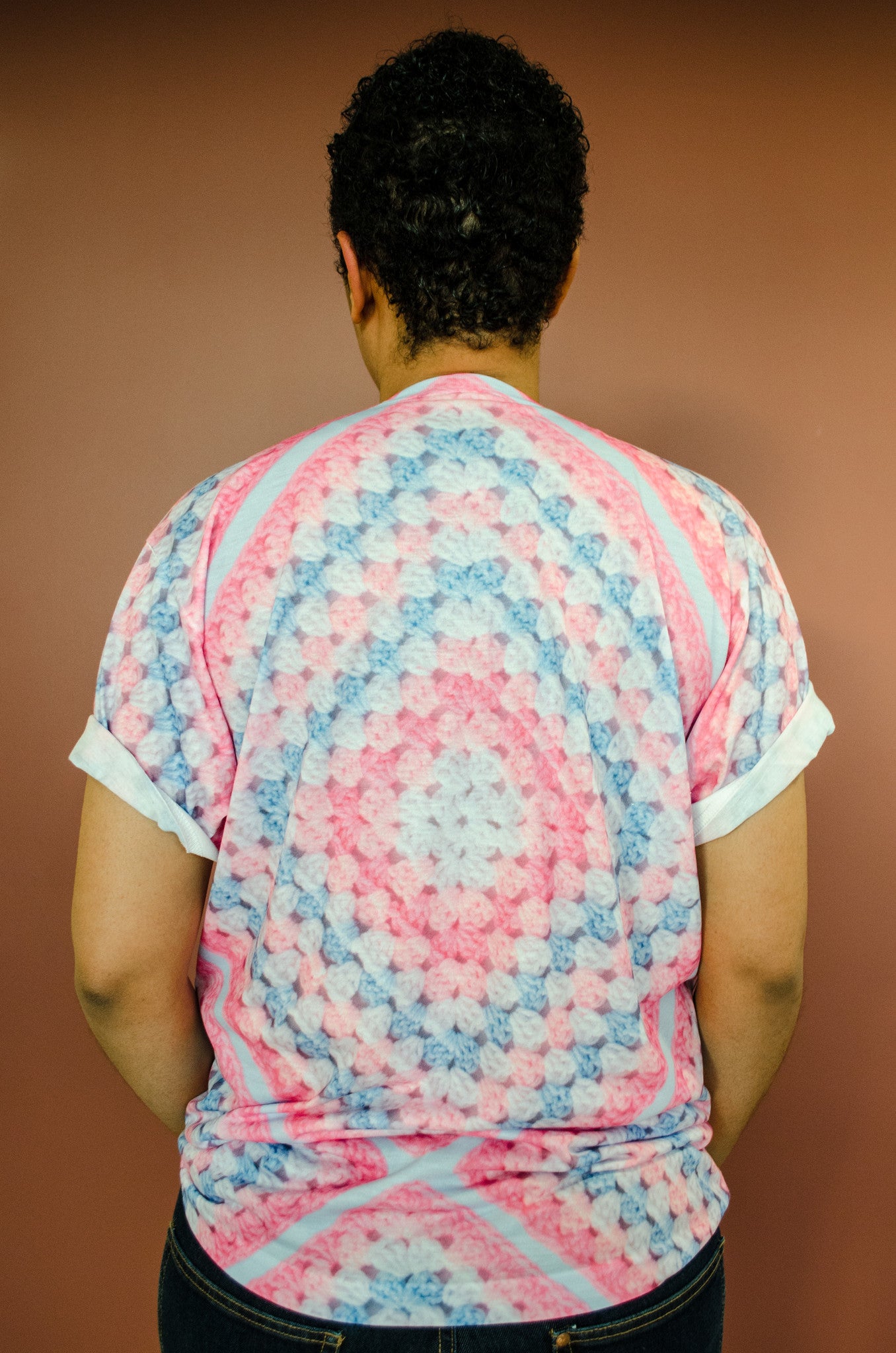 Snapdragon Brand Clothing Granny Square Crochet Print pink and blue t-shirt in style Cotton Candy features a Melanie Martinez boho feel and a pastel rainbow of colors. Made of comfortable polyester.